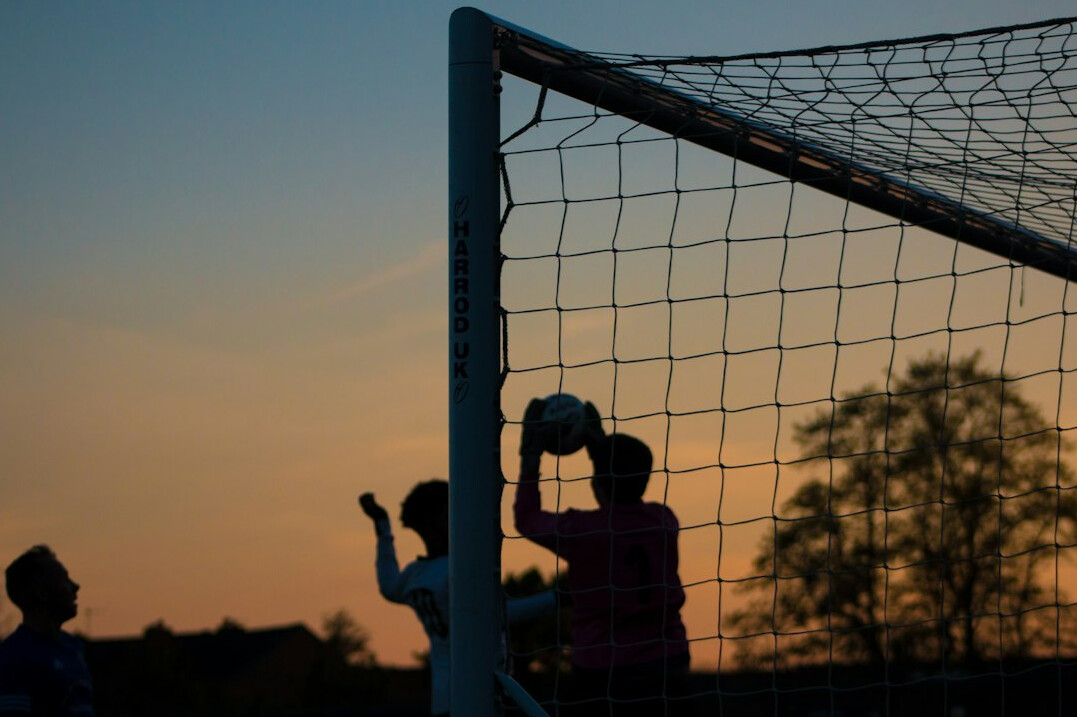 soccer player scoring goal