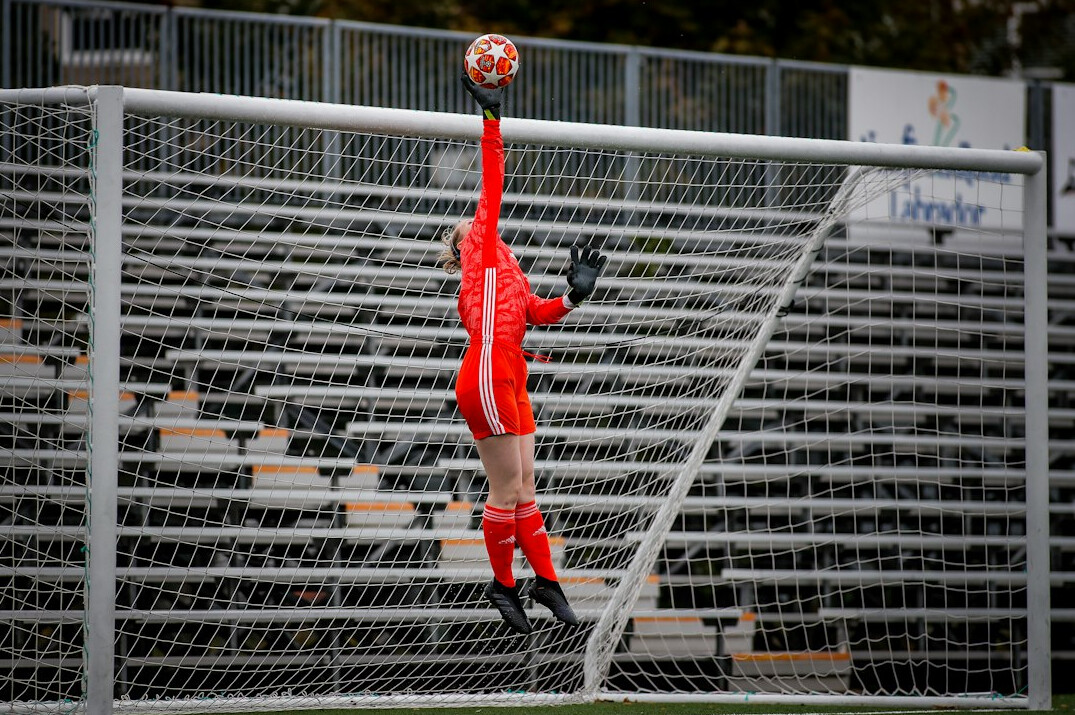 soccer player scoring goal